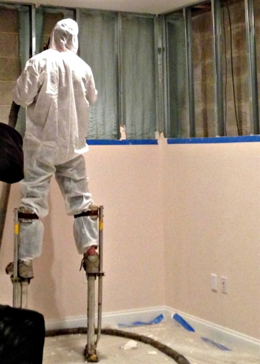 contractor applies closed-cell soy-based foam insulation